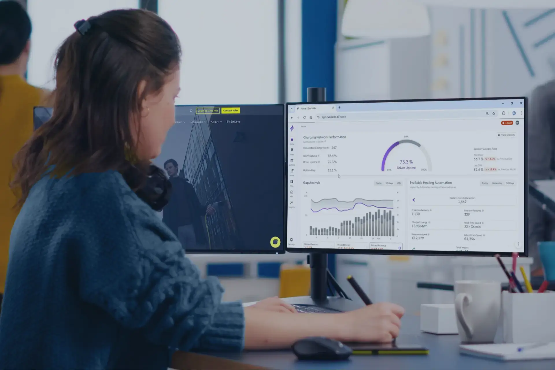 woman-at-office-desk-using-evailable-on-computer-with-blue-overlay.webp