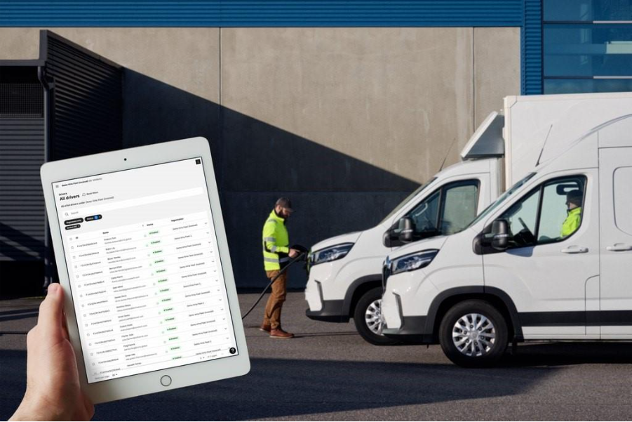 A person holding a hose next to a couple of white vans

AI-generated content may be incorrect.